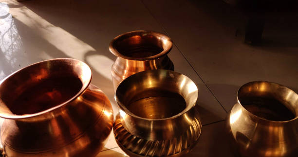 Brass lota(Hindi)/container of different shape and sizes. Brass lota(Hindi)/container of different shape and sizes. lota stock pictures, royalty-free photos & images