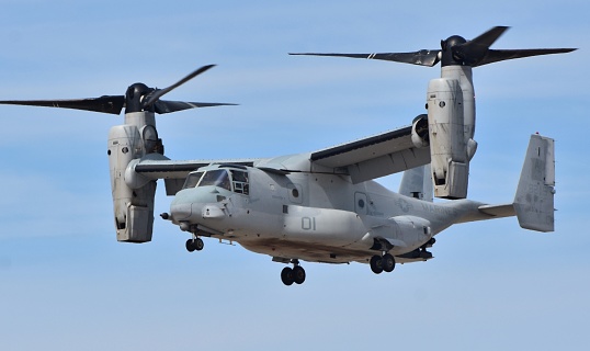 Yuma, USA - March 9, 2018: A Marine Corps MV-22 Osprey tilt-rotor aircraft flying at MCAS Yuma. This MV-22 belongs to the VMX-1 squadron and is demonstrating its ability to hover in place.