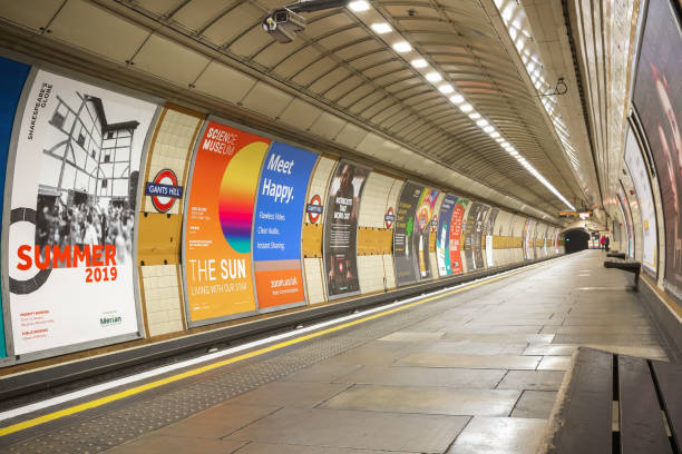 Empty platform at Gants Hill London Underground station London, UK - January 15, 2019 - Empty platform at Gants Hill London Underground station commercial sign stock pictures, royalty-free photos & images
