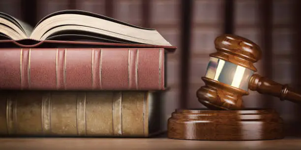 Justice, law and legal concept. Judge gavel and law books. 3d illustration