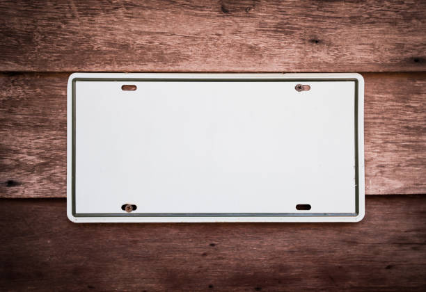 istock white metal plate on wooden wall 1135996249