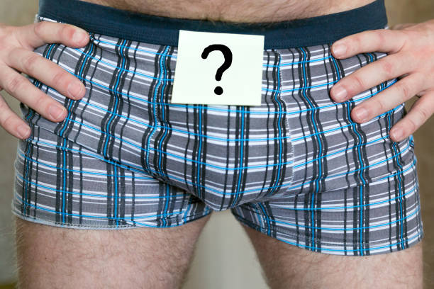 Question mark on a sticker of men's panties. The question on paper glued to men's underwear. erectile dysfunction best tablet stock pictures, royalty-free photos & images