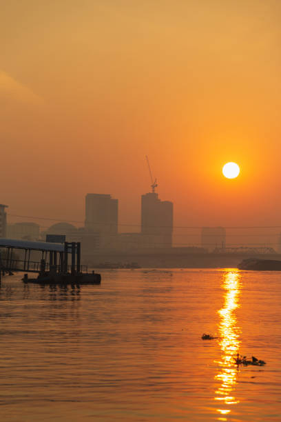 istock Pier by Chao phraya river with building and bridge at the morning. 1135998082