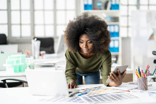 istock Afro woman on her workplace 1135998624
