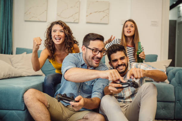 istock Friends having fun at home with video games. 1136000452