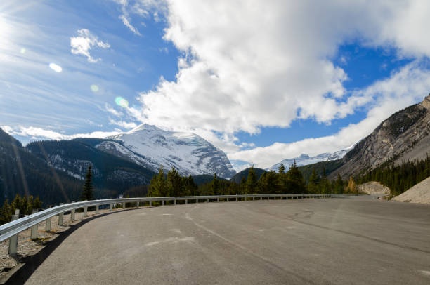 Winter view of Canadian Rockies mountains and winding Columbia icefield highway in Jasper National Park, Alberta, Canada