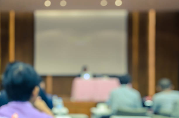 istock Abstract blur conference or seminar room 1136002819