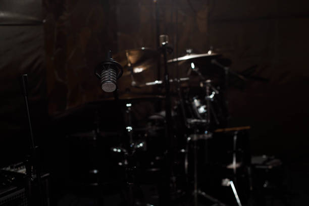 istock Black vocal microphone is stand in sound recording studio room u 1136003370