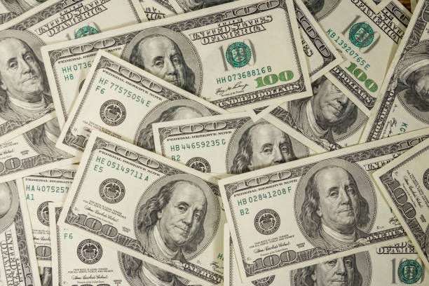 Background of the one hundred dollars bills stock photo