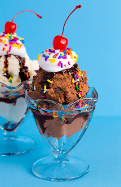 istock A Vanilla and Chocolate Sundae with Sprinkles on a Blue Background 1136008443