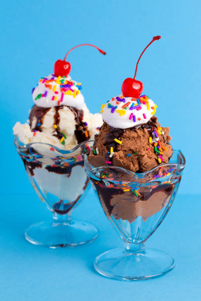 istock A Vanilla and Chocolate Sundae with Sprinkles on a Blue Background 1136008622