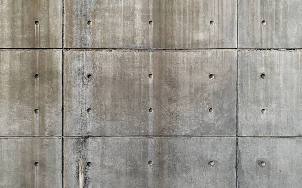 istock Texture of concrete wall with lines and many small holes 1136009659