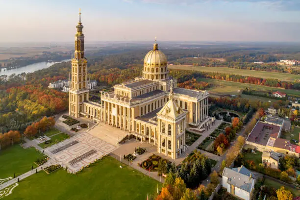 Sanctuary and Basilica of Our Lady of Liche in small village Lichen. The biggest church in Poland, one of the largest in the World. Famous Catholic pilgrimage site. Aerial view in fall. Sunset light