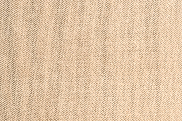 istock Textured background large beige textile. Texture of textile fabric close-up 1136012987