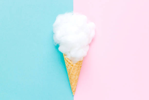 istock Composition of ice cream cone with pink wisp of bast on a light blue background. Bathroom cosmetic accessories. Flat Lay. Top View 1136014048