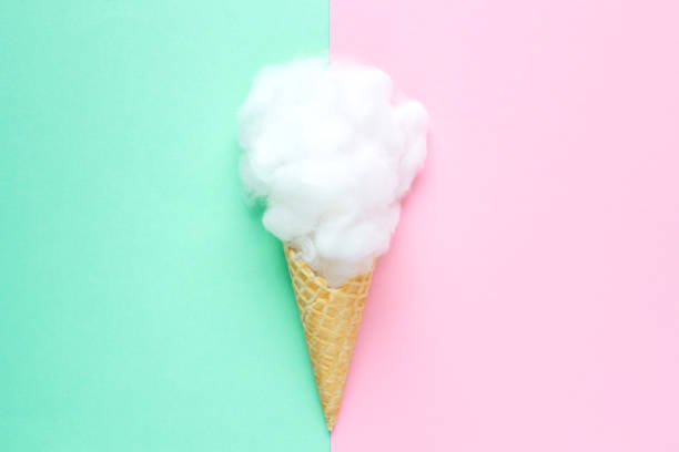 istock Composition of ice cream cone with pink wisp of bast on a light blue background. Bathroom cosmetic accessories. Flat Lay. Top View 1136014053