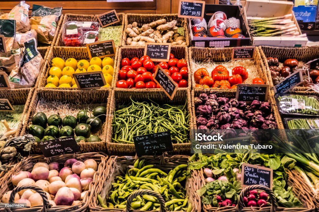 fruit and vegetables at the counter of a covered market covered market with multicolored fruit and vegetable counter Market - Retail Space Stock Photo