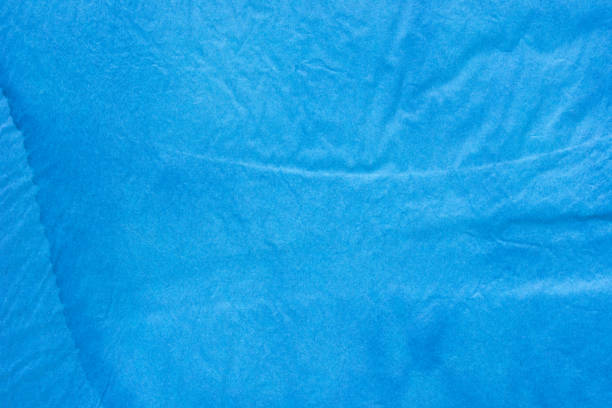 istock blue watercolor painted background texture on creased paper 1136015343