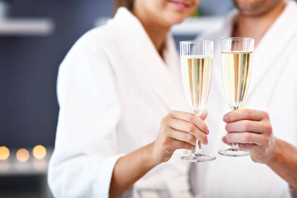 Adult happy couple relaxing in spa salon stock photo