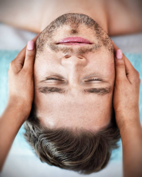 istock Handsome man having massage in spa salon 1136017374