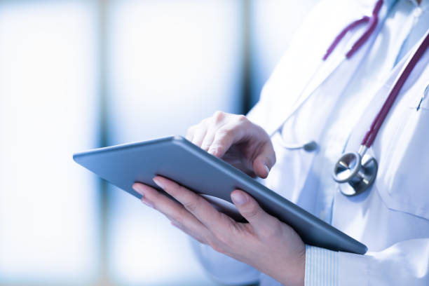 istock Medical doctor using smart tablet for work in hospital 1136017500