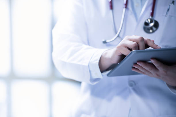 istock Medical doctor using smart tablet for work in hospital 1136017507
