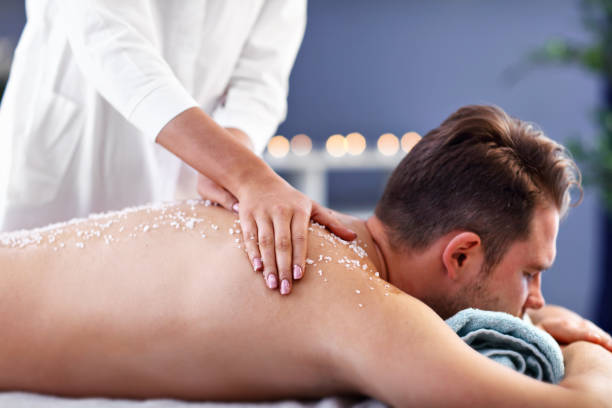 istock Handsome man having massage in spa salon 1136017532