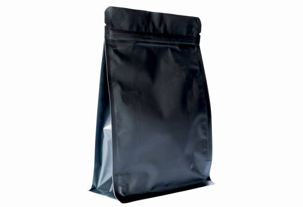istock matt black flat bottom coffee pouch  with zipper  filled with coffee beans on white background fron view 1136018510