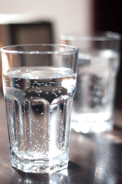 istock Glass with mineral water on the table 1136019544