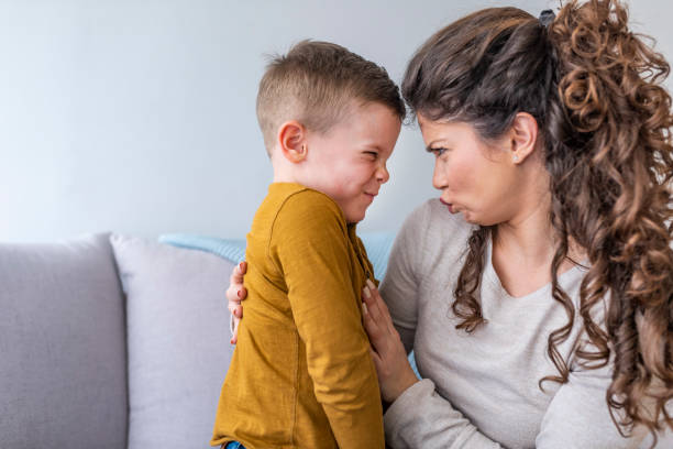 istock Mother and son having fun at home 1136020984
