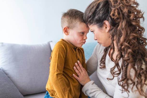 istock Mother and son having fun at home 1136021832