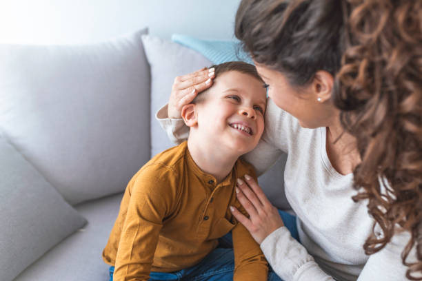 istock Happy little boy hugging her mother. 1136023115