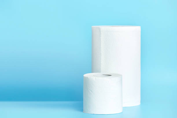 istock Toilet paper litchen towel on empty space blue background. 1136023605