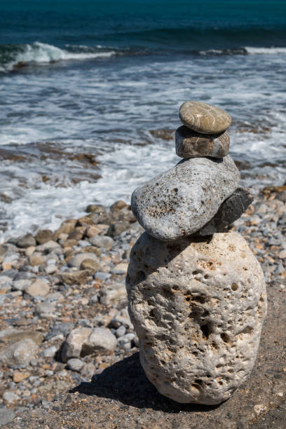 istock Pebbles pyramid at the coastline 1136026992
