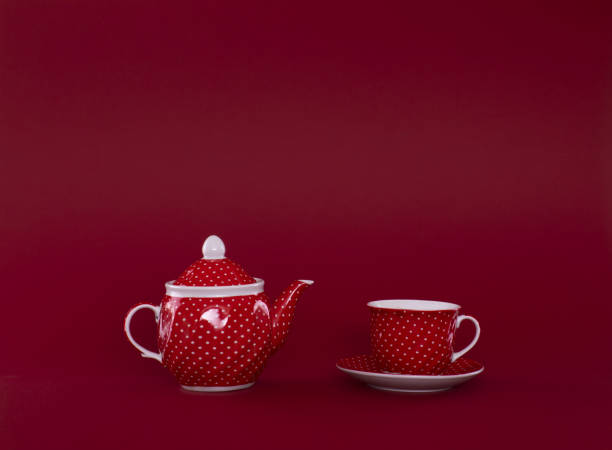 istock red ceramic teapot and red cup on a red background 1136027358