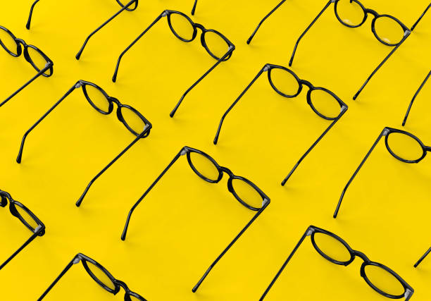 istock a lot Glasses on Yellow Background 1136027484