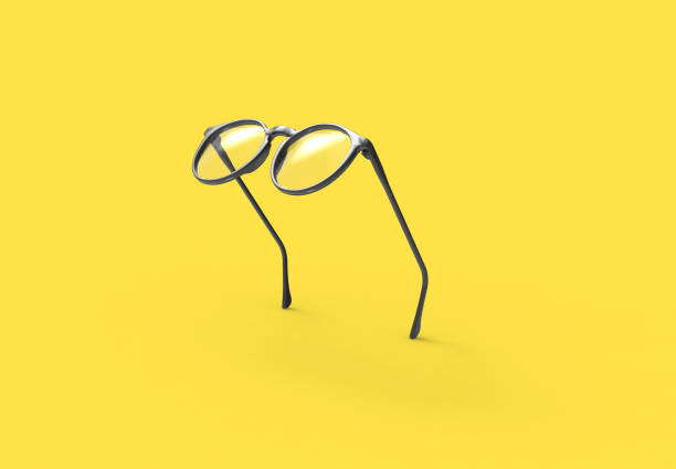 Studio shot of flying Black glasses on yellow background