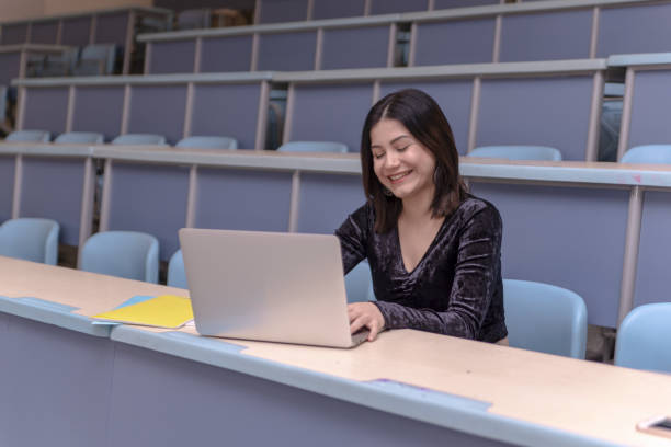 istock Woman working on laptop in a classroom 1136028425