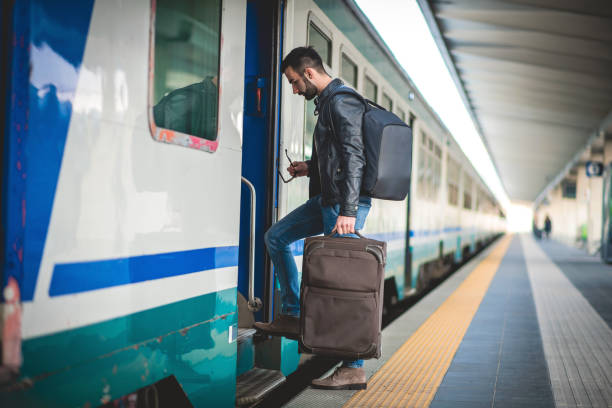 Young Man Boarding a Train - fotografia de stock