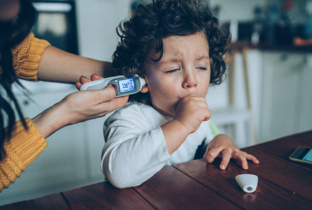 Measuring little boy's temperature