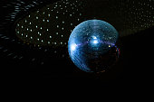 Shiny disco ball on the ceiling.
