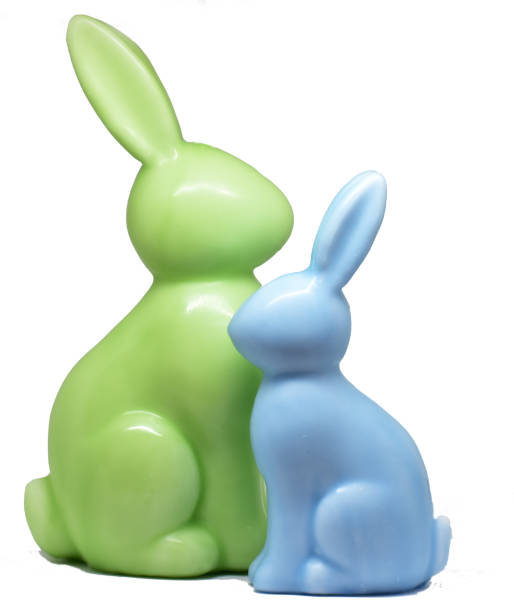 istock wax rabbits figurines on white background 1136035099