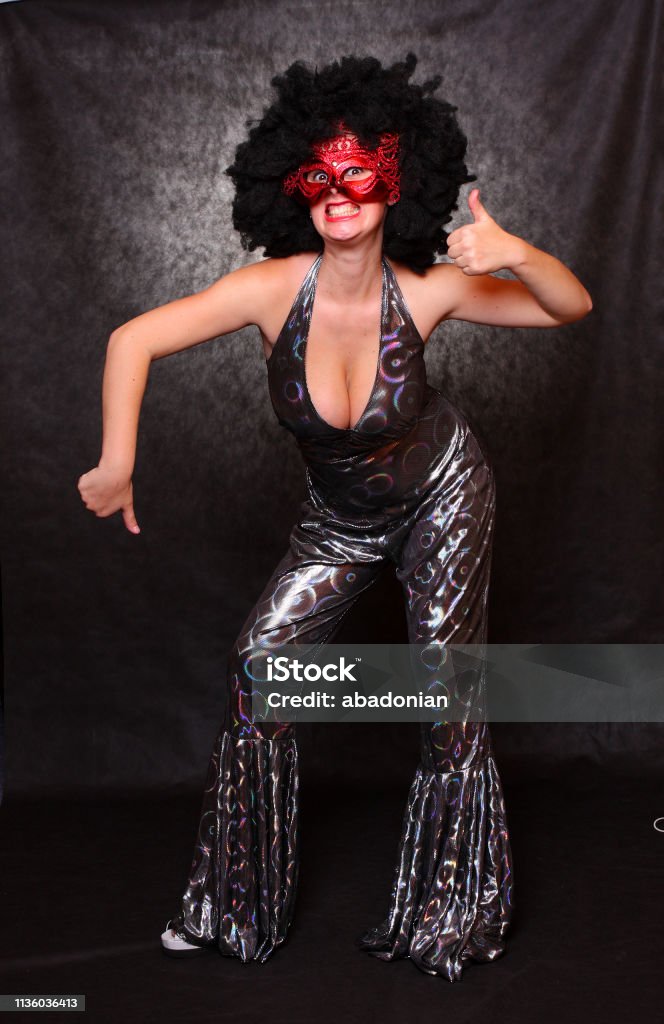 Pretty Woman With Red Mask And Afro Hairstyle Dressed In Luxury Retro Costume Stock Photo - Download Image Now - iStock Pretty Woman With Red Mask And Afro Hairstyle Dressed In Luxury Retro Costume Stock Photo - Download Image Now - iStock