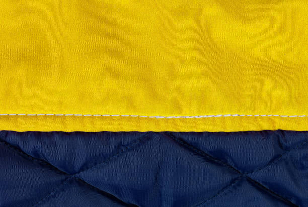 istock Closeup of a Yellow and Blue Down Jacket 1136037483