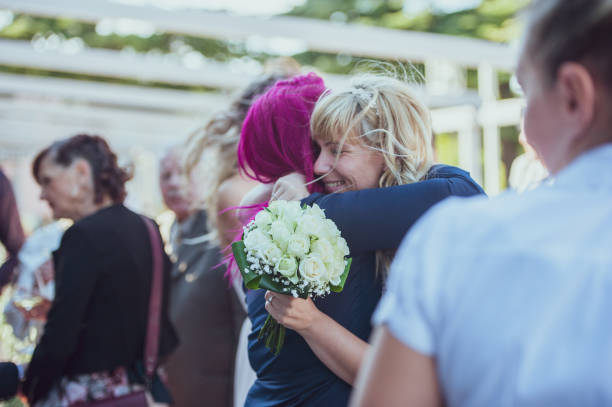 Hugging and Congratulating the Bride after Wedding Ceremony.