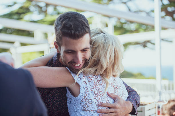 istock Smiling Best Man Hugging and Congratulating the Bride 1136037855