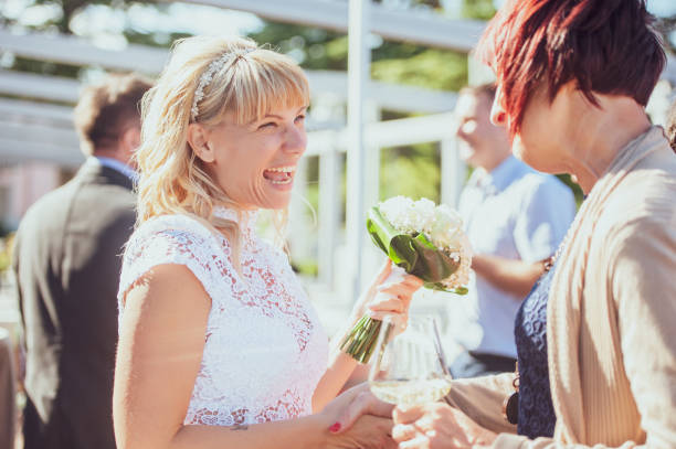istock Bride Having Fun With Her Friends After Wedding Ceremony 1136037861