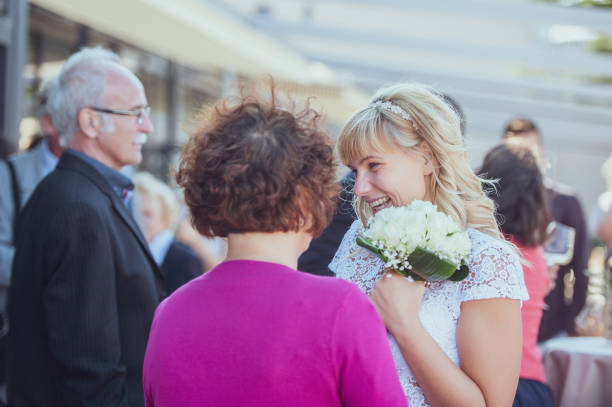 istock Bride Socializing With Guests After Wedding Ceremony 1136037862