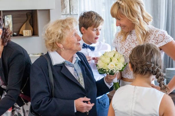 istock Bride Socializing With Senior Woman at Wedding 1136037901