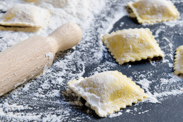 istock Process of making italian ravioli, close up on a black backgound 1136039038